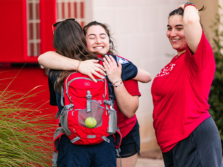 College students embrace during move-in weekend at Muhlenberg College.