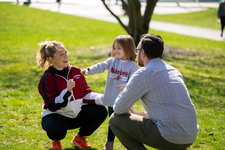 Parents outside with their child