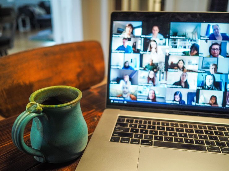 A mug and a laptop on a table