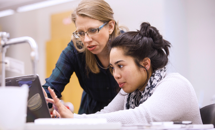 A faculty member helping a student